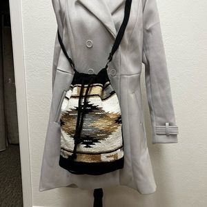 Textured Aztec Drawstring Crossbody Bag in Black and Tan